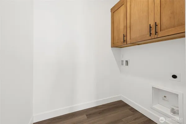 a view of cabinets and wooden floor