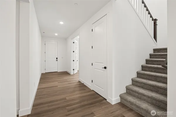 a view of entryway with wooden floor