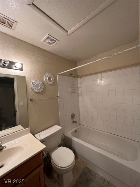 8410 Eldora Avenue, Unit 2020 Las Vegas, NV 89117 - Photo 7 of 10 Full bath with visible vents, toilet, a textured w