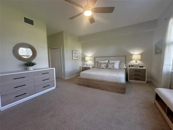 a bedroom with a bed and a dresser