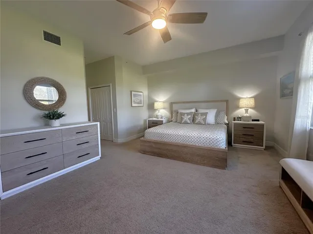 a bedroom with a bed and a dresser