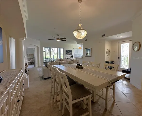 a kitchen with a table and chairs in it