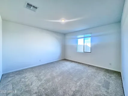 a view of a swimming pool and an outdoor seating