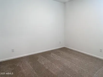 a kitchen with stainless steel appliances granite countertop a sink stove microwave and refrigerator