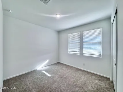 a bathroom with a granite countertop sink toilet a mirror and shower