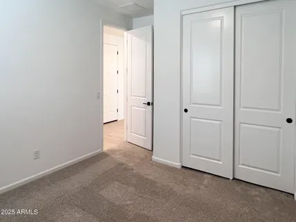 a kitchen with stainless steel appliances granite countertop a stove a sink a refrigerator and a microwave