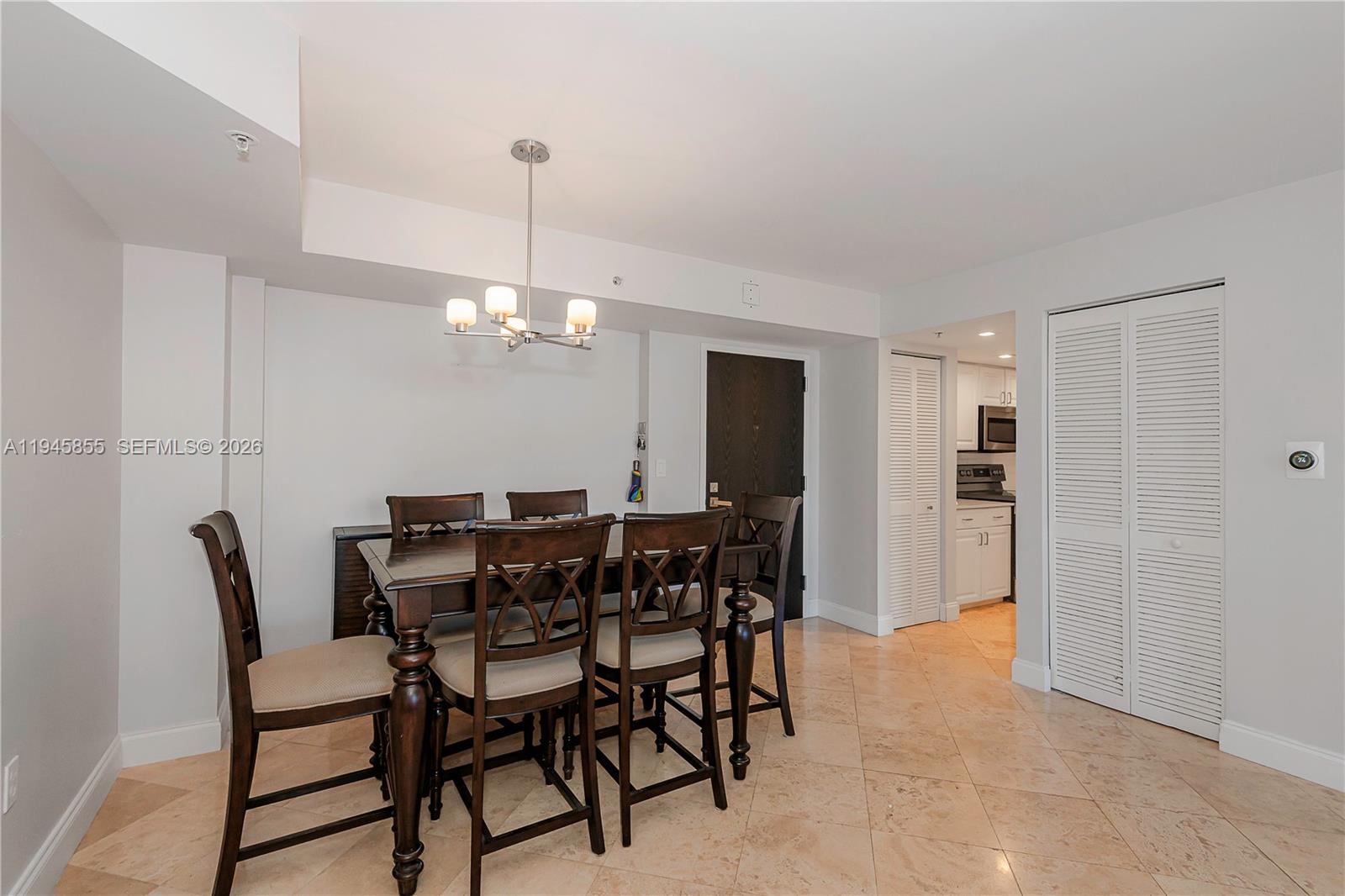 90 Alton Road, Unit 301 Miami Beach, FL 33139 - Photo 12 of 30 a view of a dining room with furniture