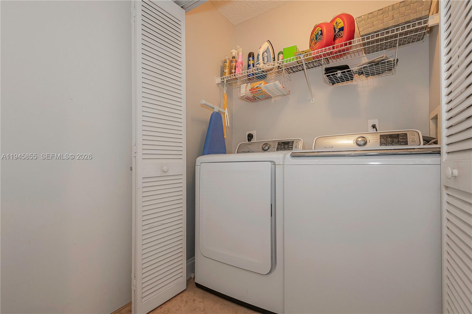 90 Alton Road, Unit 301 Miami Beach, FL 33139 - Photo 27 of 30 a utility room with dryer and washer