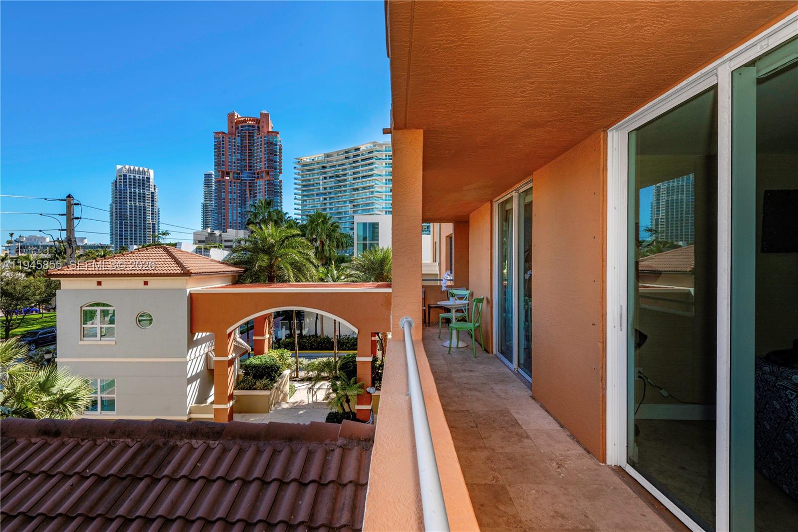90 Alton Road, Unit 301 Miami Beach, FL 33139 - Photo 6 of 30 a view of a balcony with chairs
