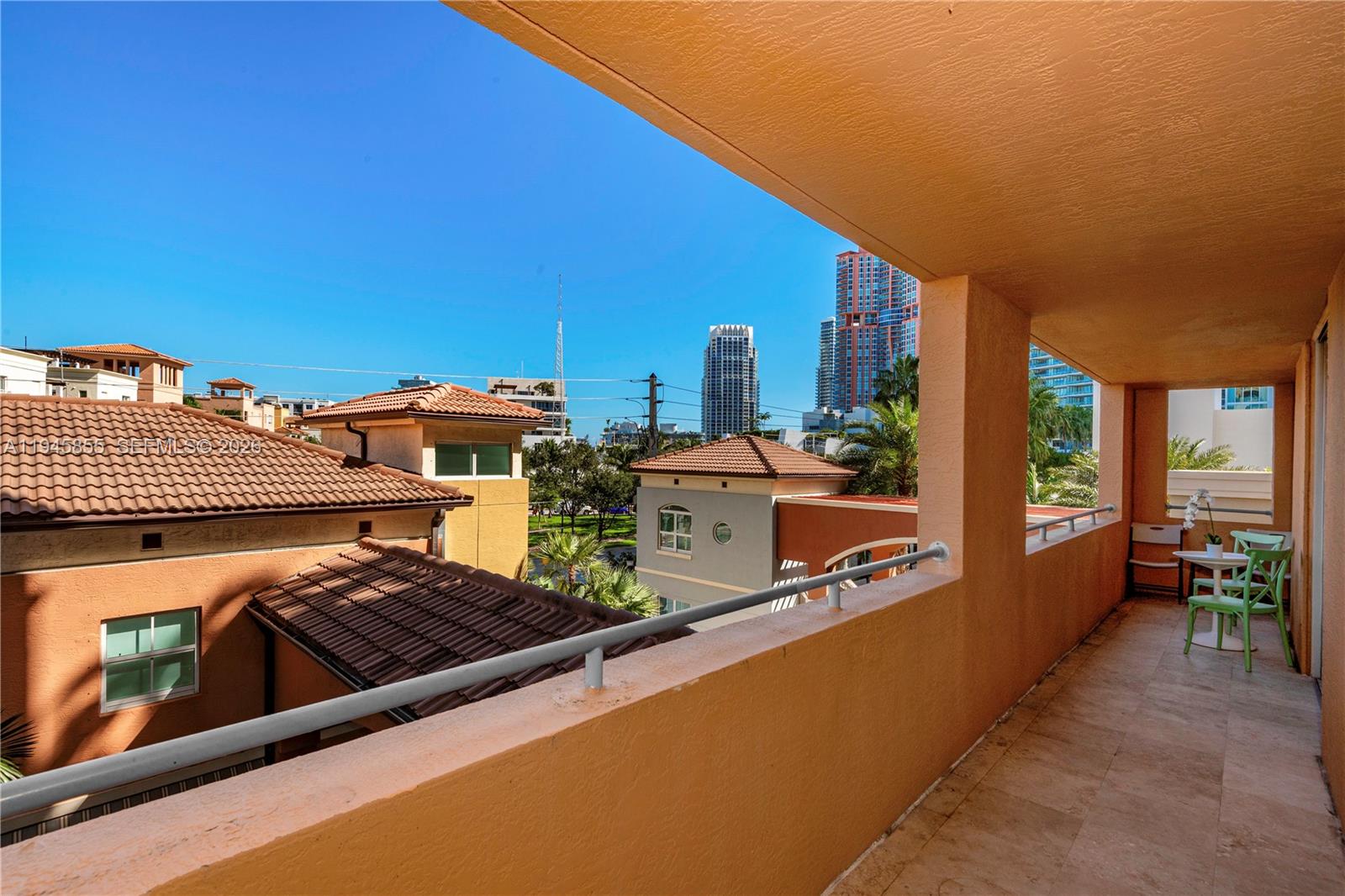 90 Alton Road, Unit 301 Miami Beach, FL 33139 - Photo 8 of 30 a view of a swimming pool with chairs