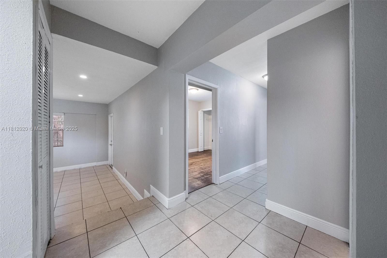 725 Northeast 178th Street Miami, FL 33162 - Photo 23 of 44 a view of an empty room and window
