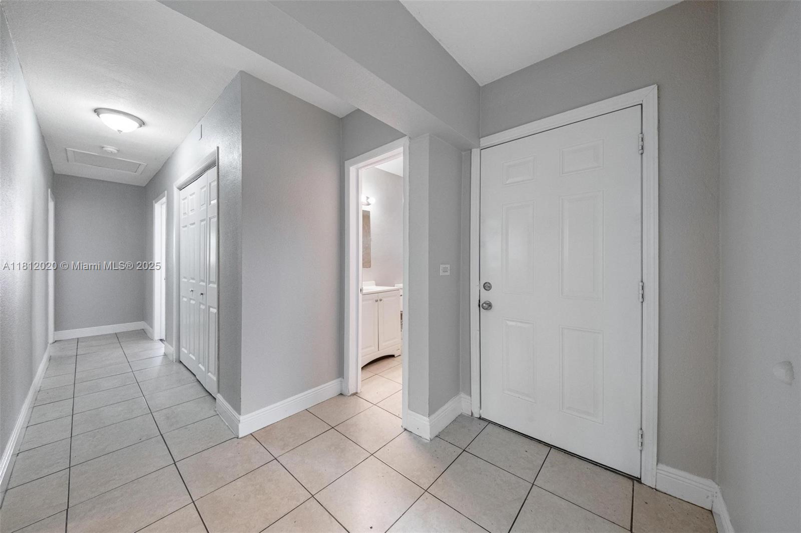 725 Northeast 178th Street Miami, FL 33162 - Photo 25 of 44 a view of an empty room and window