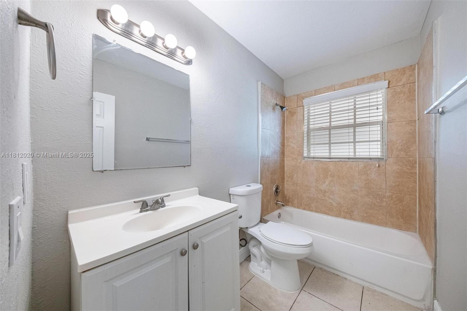 725 Northeast 178th Street Miami, FL 33162 - Photo 26 of 44 a bathroom with a sink a toilet and shower