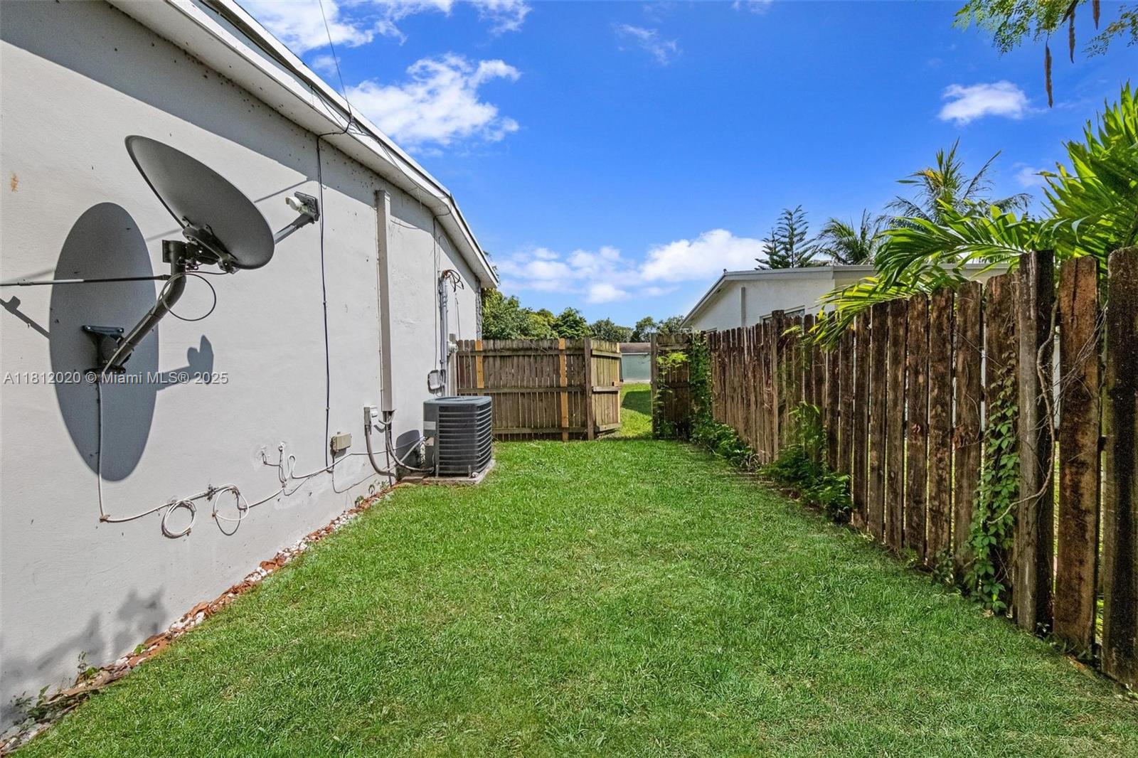725 Northeast 178th Street Miami, FL 33162 - Photo 35 of 44 a view of a backyard with potted plants