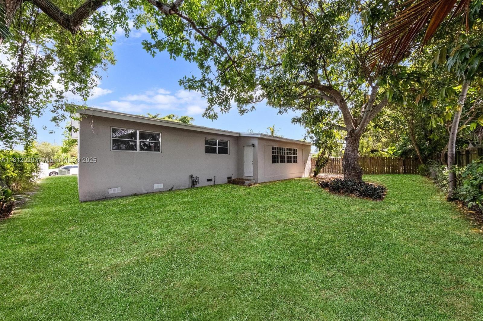 725 Northeast 178th Street Miami, FL 33162 - Photo 39 of 44 a house view with a garden space