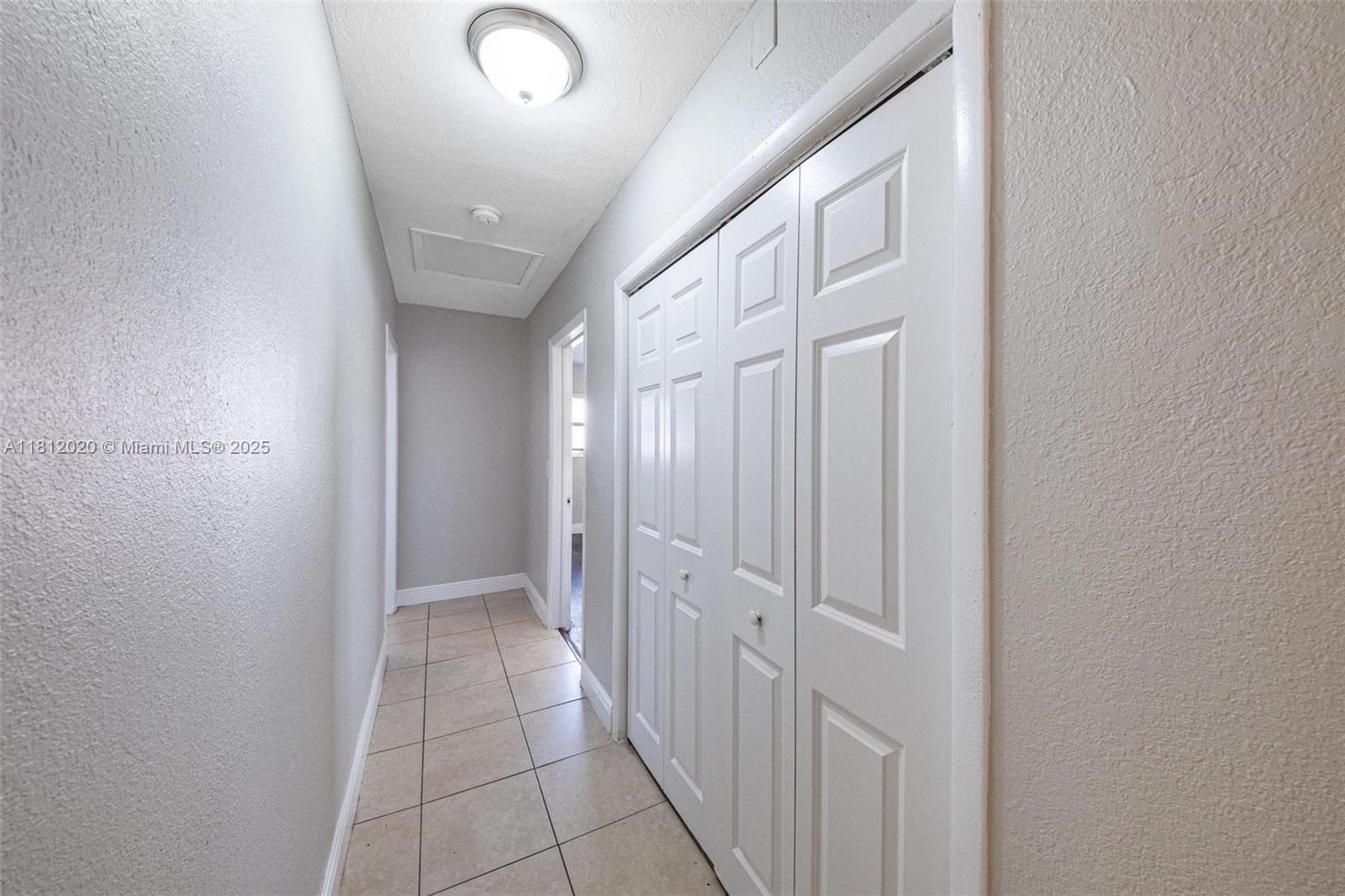 725 Northeast 178th Street Miami, FL 33162 - Photo 10 of 44 a view of a hallway