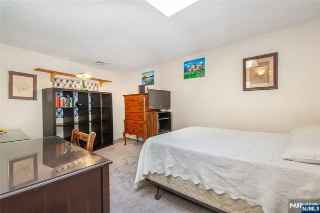 a bed room with a bed and a window