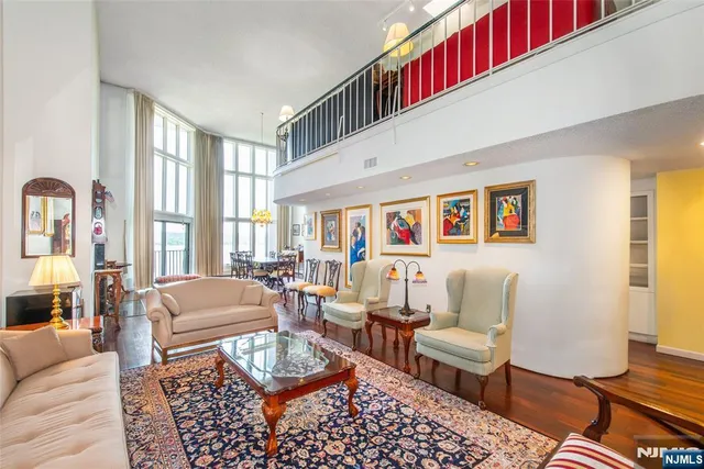 a living room with furniture and a rug