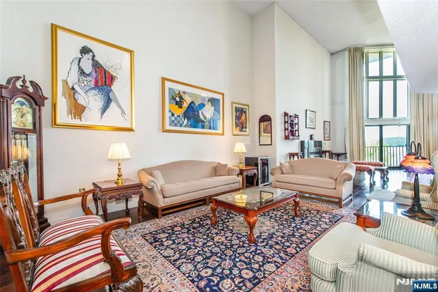 a living room with furniture and a rug