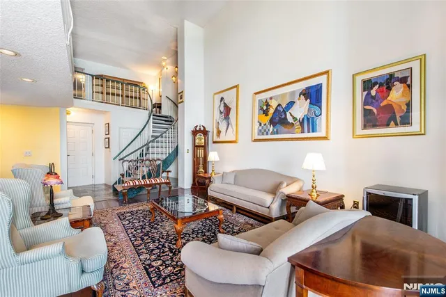 a living room with fireplace furniture and a wooden floor