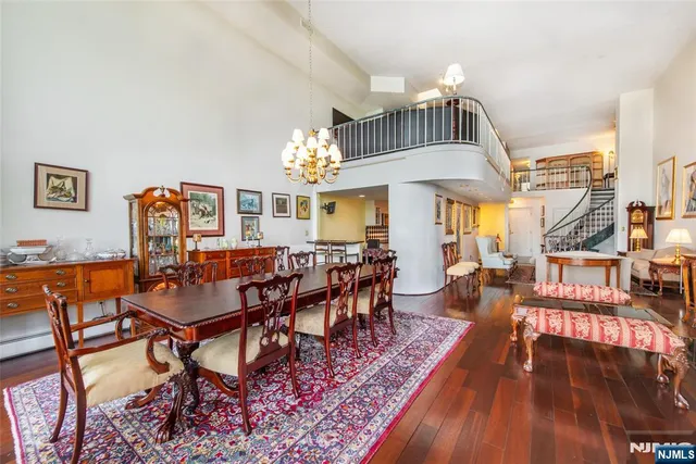 a kitchen with granite countertop lots of counter top space and wooden floor