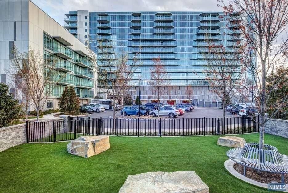 320 Adolphus Avenue, Unit 815 Cliffside Park, NJ 07010 - Photo 20 of 25 a front view of a building with garden and seating area