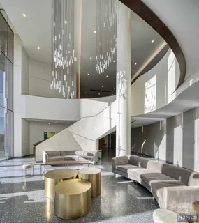 a living room with fireplace and furniture