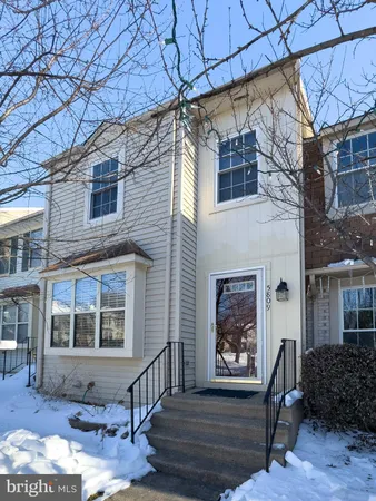 a front view of a building with large windows