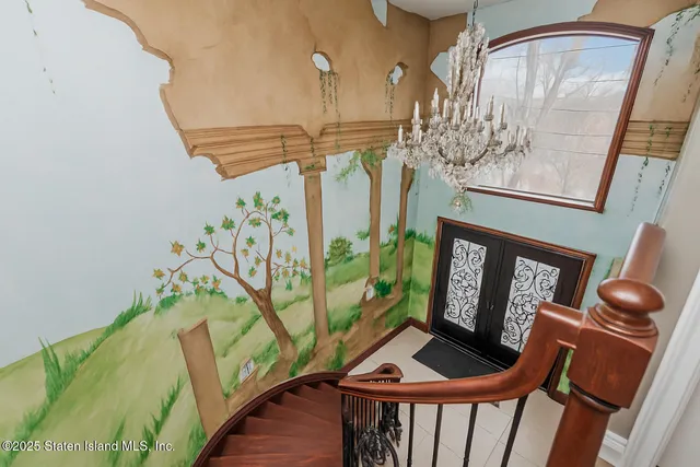 a bedroom with a bed a table and chair