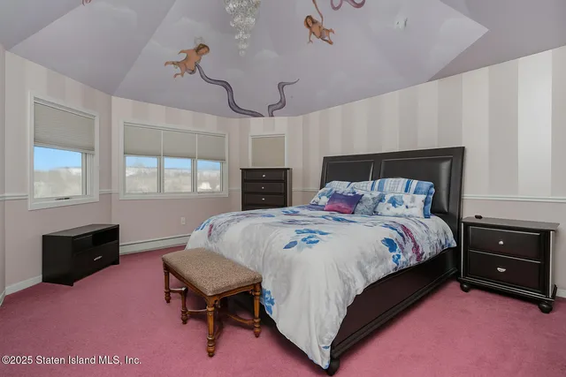 a bedroom with furniture and a window