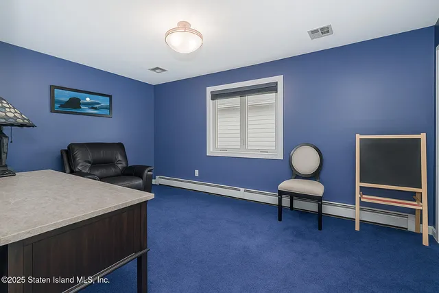 a bedroom with bed and a window