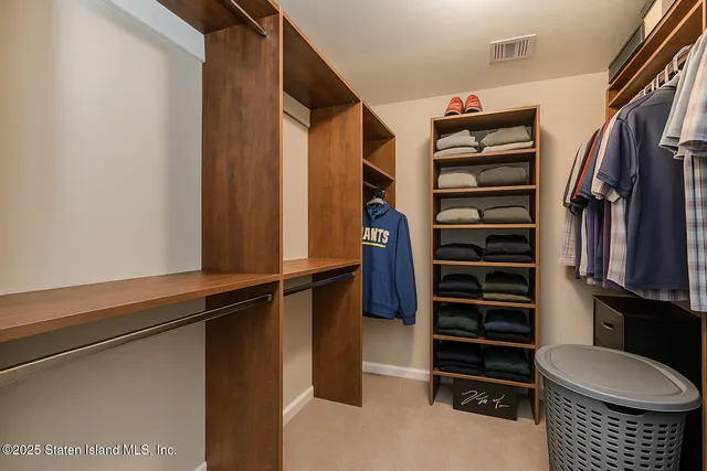 a bedroom with a bed and a ceiling fan