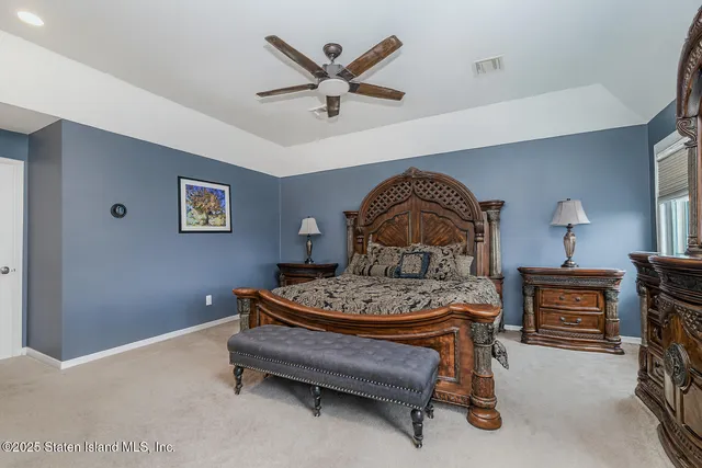 a bathroom with a double vanity sink mirror and shower