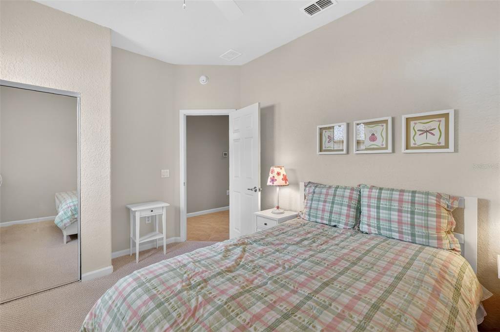 7271 Southwest 95th Court Ocala, FL 34481 - Photo 16 of 39 a bedroom with a bed and painting on the wall