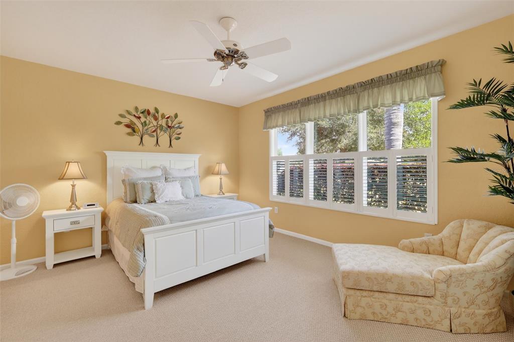 7271 Southwest 95th Court Ocala, FL 34481 - Photo 17 of 39 a bedroom with a large bed and a window