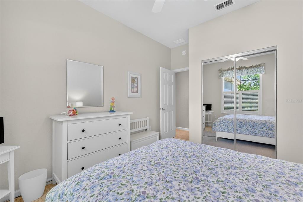 7271 Southwest 95th Court Ocala, FL 34481 - Photo 20 of 39 a bedroom with a bed and a dresser