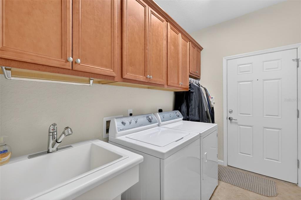 7271 Southwest 95th Court Ocala, FL 34481 - Photo 26 of 39 a utility room with dryer and washer