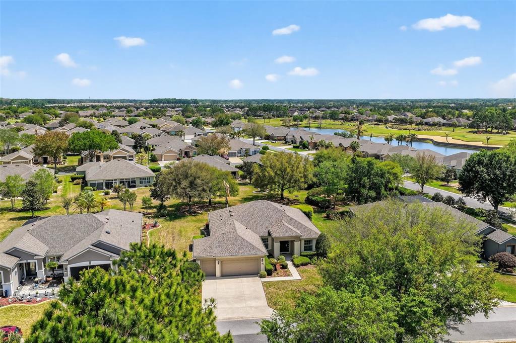 7271 Southwest 95th Court Ocala, FL 34481 - Photo 31 of 39 an aerial view of a house with a garden and lake view