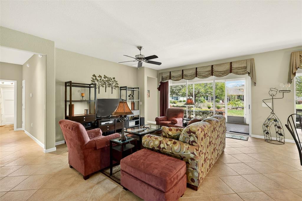 7271 Southwest 95th Court Ocala, FL 34481 - Photo 8 of 39 a living room with furniture and a large window