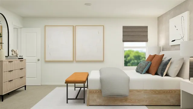 a bedroom with a bed and chair
