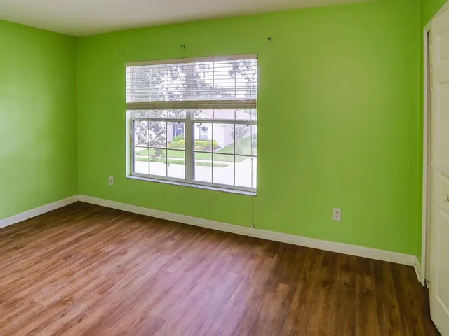 a view of room with window and hardwood