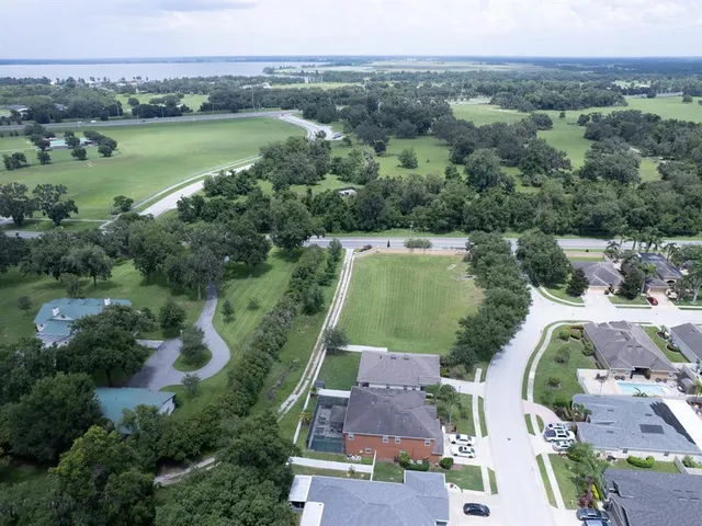 an aerial view of a city with lake view