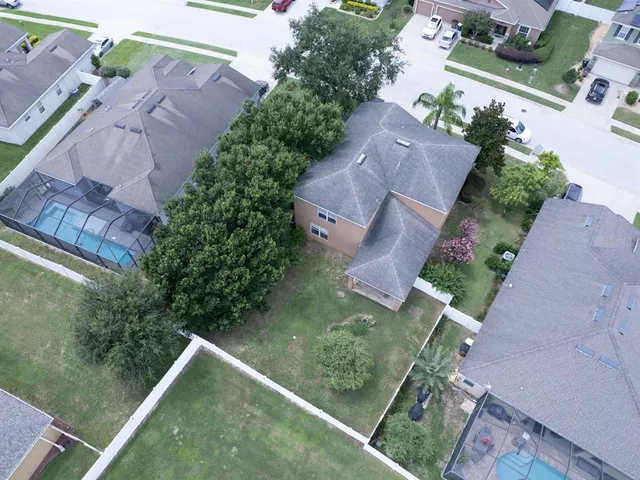 an aerial view of house with yard