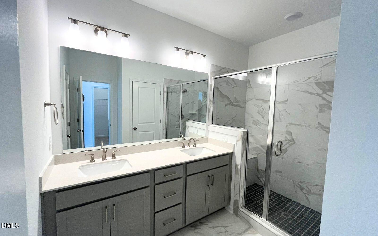 2430 Whitewing Lane Wendell, NC 27591 - Photo 12 of 31 a bathroom with a double vanity sink mirror and double