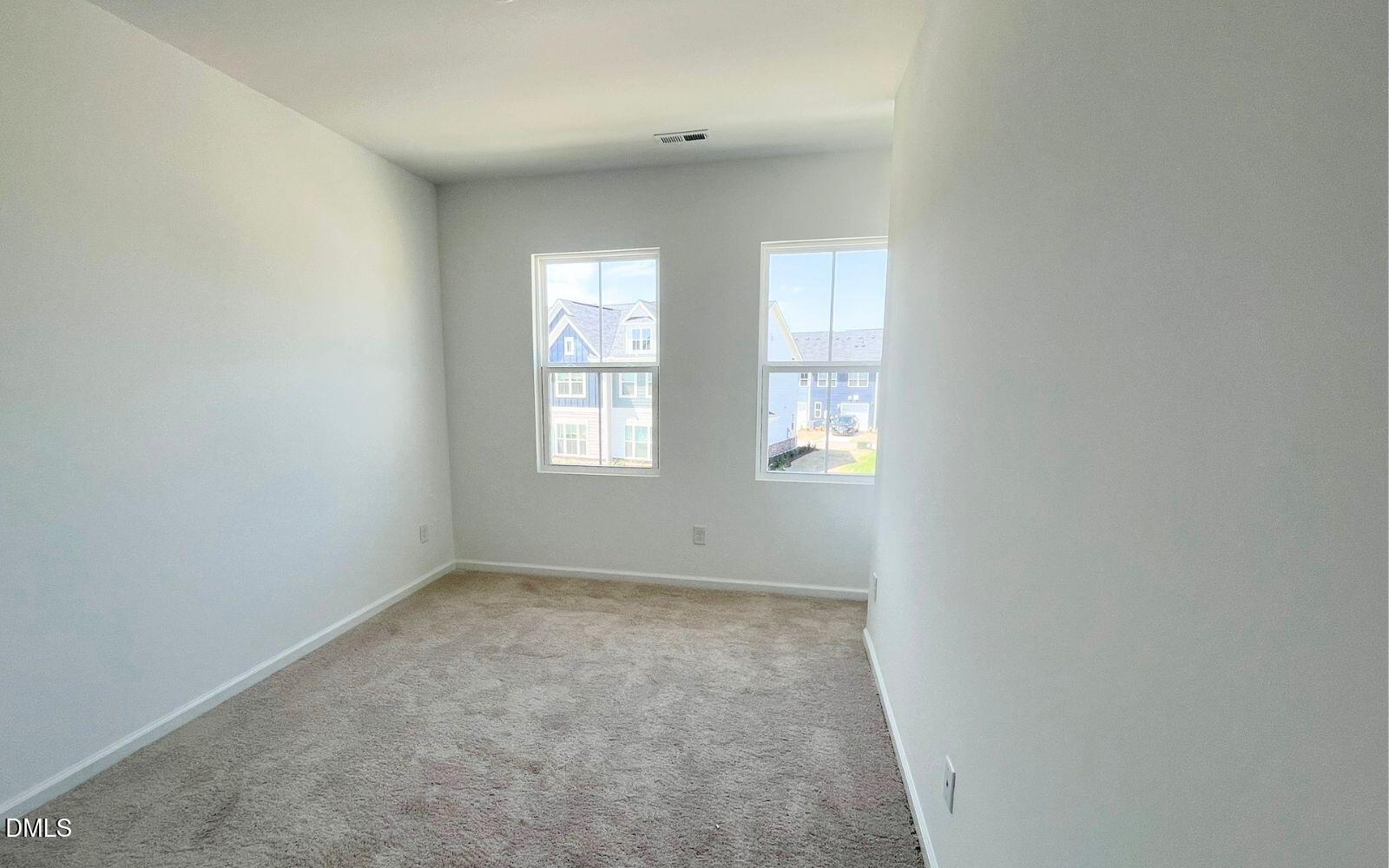 2430 Whitewing Lane Wendell, NC 27591 - Photo 14 of 31 an empty room with windows