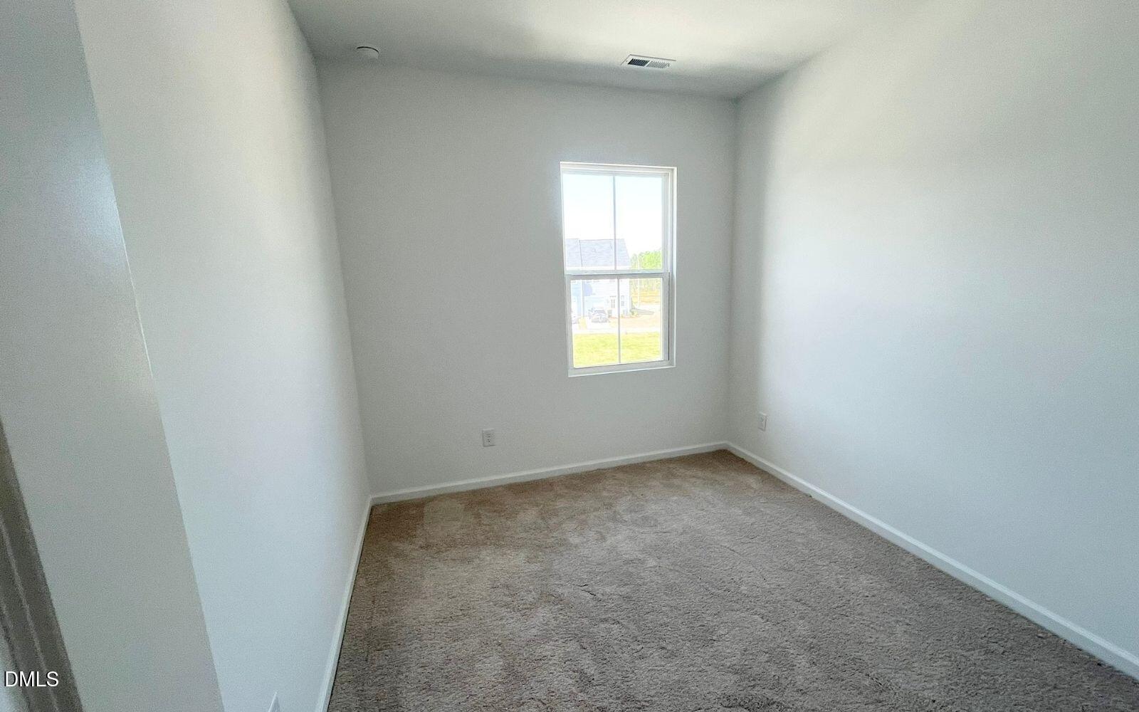2430 Whitewing Lane Wendell, NC 27591 - Photo 15 of 31 an empty room with a window
