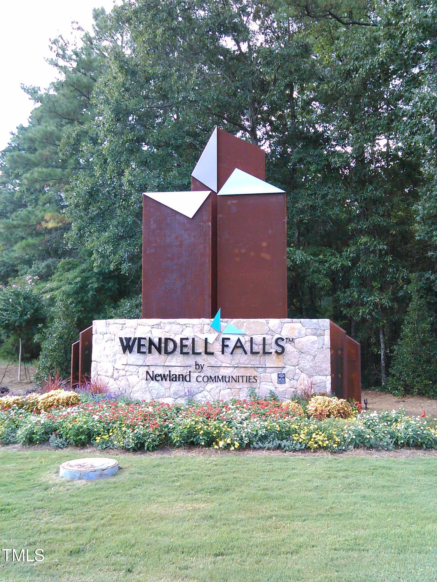 2430 Whitewing Lane Wendell, NC 27591 - Photo 18 of 31 a sign on the side of a building