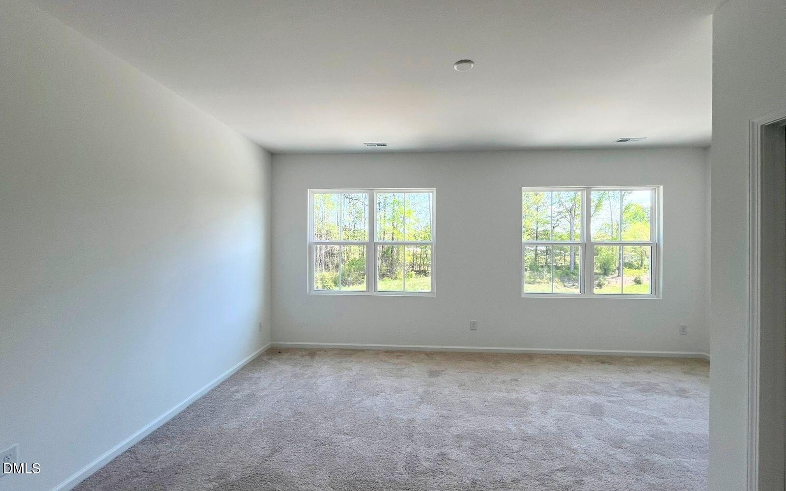 2430 Whitewing Lane Wendell, NC 27591 - Photo 9 of 31 an empty room with windows