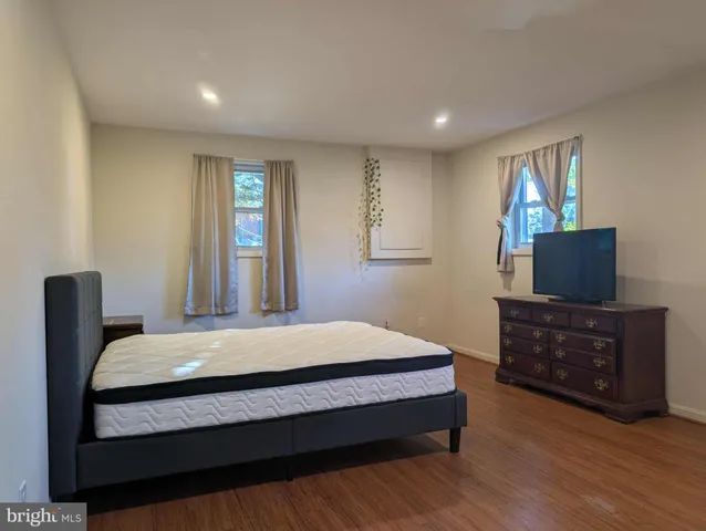 a bedroom with a bed and furniture