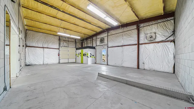 a view of game room with window and fireplace